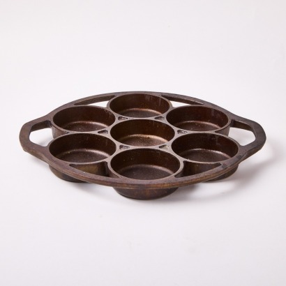 An American Cast Iron Mini Cake Pan By Lodge