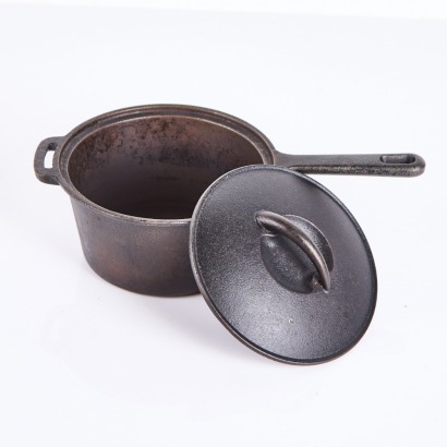 A Cast Iron Pot With Lid