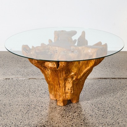 A Stump Based Glass Top Coffee Table