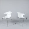 A Set of Four Infiniti Loop Chairs 