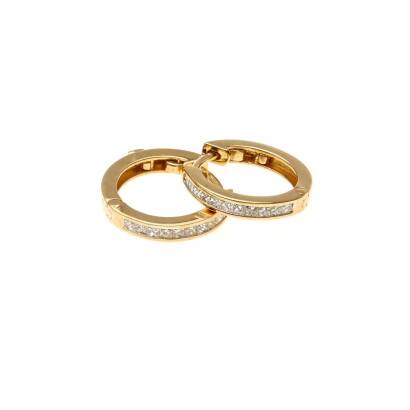 A pair of diamond hoop earrings, the front section channel set with princess cut diamonds of known total weight 0.50 carat. 18ct yellow gold. Weight 5 grams. Diameter 18mm.
