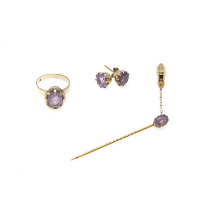 A collection of amethyst jewellery including stud earrings, ring and stick pin. Yellow gold. Weight 7.48 grams.