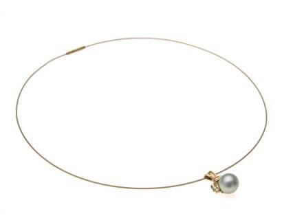 A Tahitian pearl and diamond pendant on wire, the 9.5mm round pearl with diamond set surmount, hung on a fine gold wire. 9ct yellow gold.  