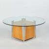 A Circular Glass Coffee Table with Block Base