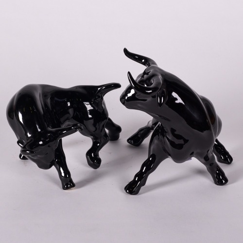 A Pair Of Black Ceramic Bulls