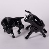 A Pair Of Black Ceramic Bulls