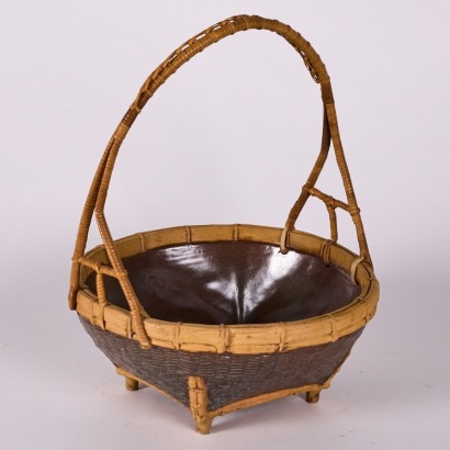 A Japanese Ceramic Rattan Bowl With Handle