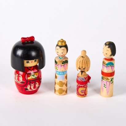 A Set of Four Kokeshi Dolls