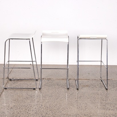A Trio of Minimal Sleigh Base White Bar Stools