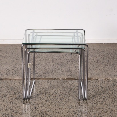 A Set of Glass Topped Nesting Tables