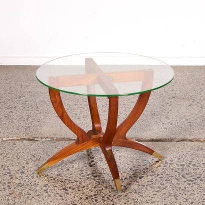 A Vintage Spider Leg Coffee Table With A Glass Top