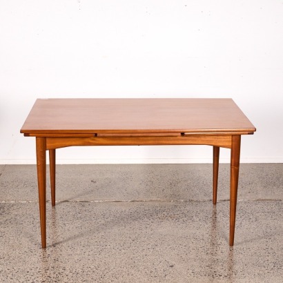 A Mid-Century Extendable Dining Table