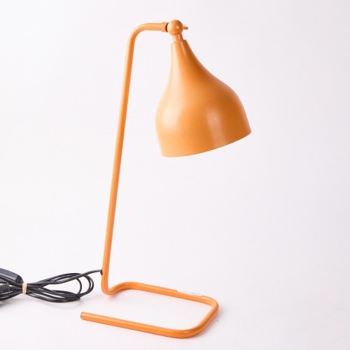 An Orange Table Lamp with Adjustable Shade