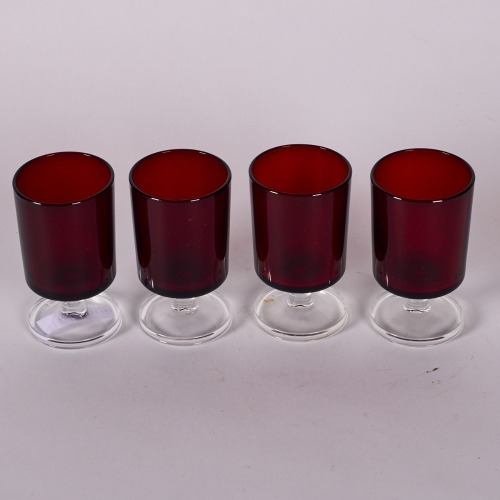 A Set of Four Red Glass Liquor Glasses