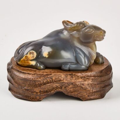 A Chinese Qing Dynasty Agate 'Buffalo' Ornament With Original Old Wooden Stand