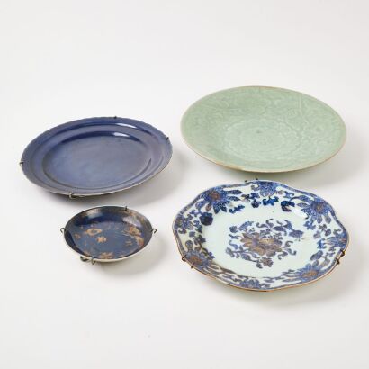 A Chinese Qing Dynasty Celadon-Glazed Dish And A Blue And White Gilt-Decorated Dish And Two Blue-Glazed Gilt- Decorated Dishes