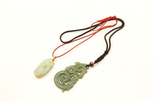 Two Chinese Green Jade Carved Fish Pendants