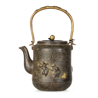 A Gilt Japanese Iron Teapot with incised child playing game