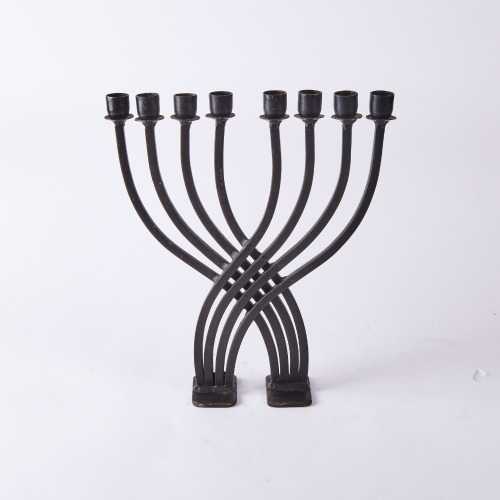 A Large Cast Iron Menorha Candelabra