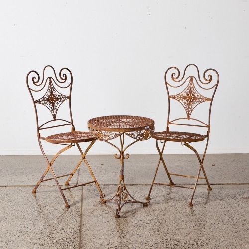 A Metal French Bistro Table Patio and Chairs