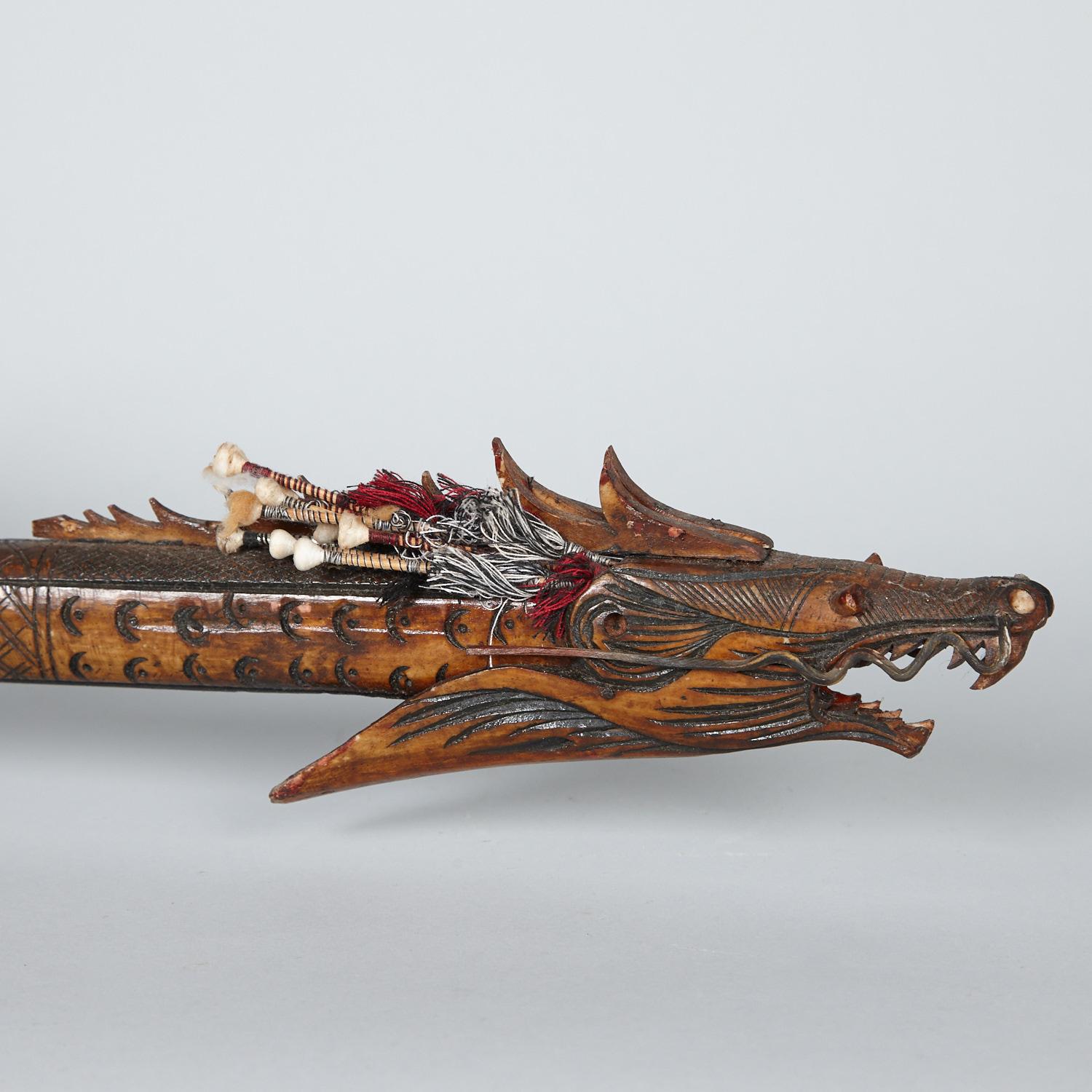 A Borneo Dragon-Shaped Carved Bone Dart Blow Gun