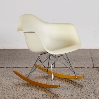 An Eames Plastic Rocking Chair RE RAR by Vitra