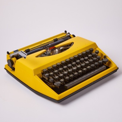 An Adler Tippa Portable Yellow Typewriter c.1960s