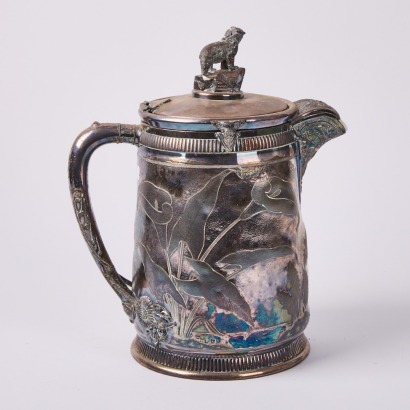 A Reed and Barton Silverplate Waterpitcher with Ceramic Insulator