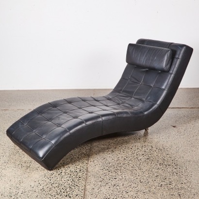 A Black Leather Chaise Loungue