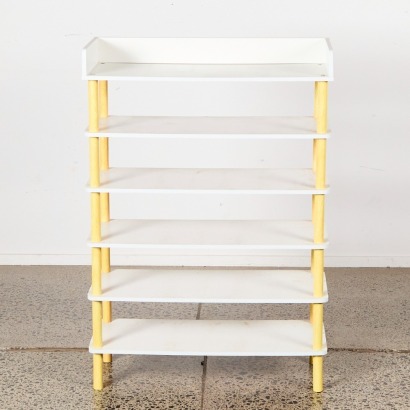 A Children's Book Shelf with Yellow Posts