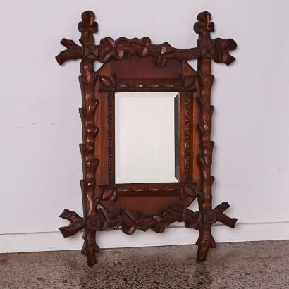 A Vintage French Black Forest Carved Mirror