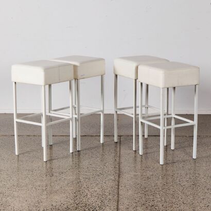 A Set of Four White Bar Stools