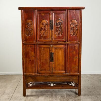 A Chinese old wooden four door cabinet