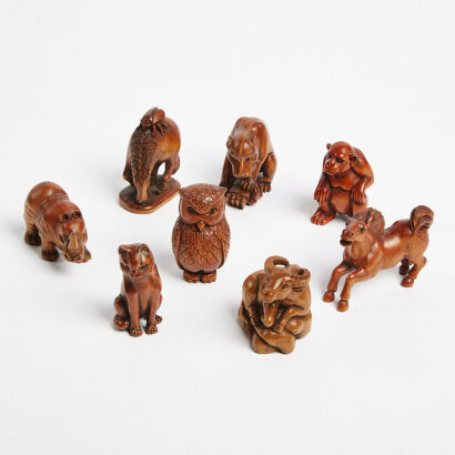 A Collection Of Eight Small Hand Carved Wooden Animal Figures