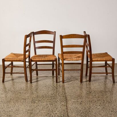 A Set Of Four Rush Base Chairs