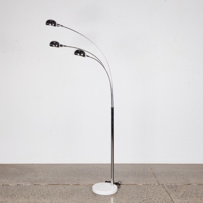 A Three-Arm Chrome Floor Lamp