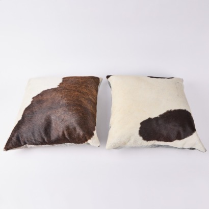 A Pair Of Cow Hide Cushions