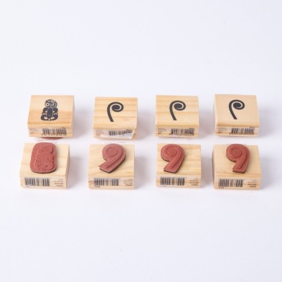 A Collection Of Eight Hei Tiki And Koru Rubber Stamps
