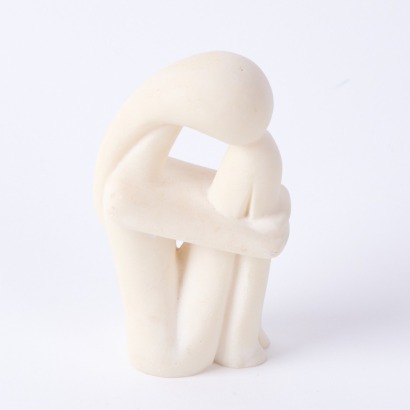 A Carved and Moulded Resin Figure