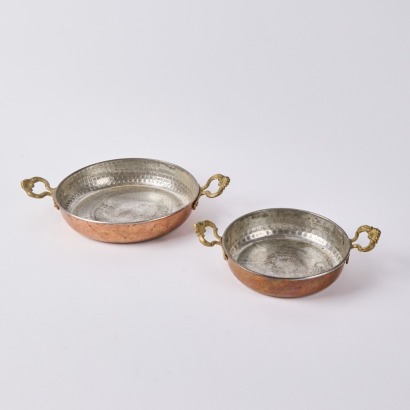 A Pair of Beaten Copper Serving Dishes