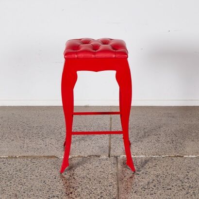 A Red Cushioned Stool