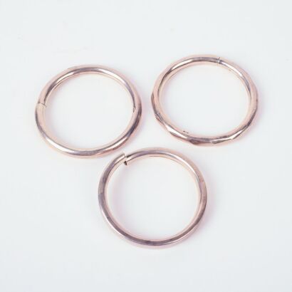 A Trio Of Hollow Antique Sterling Silver Bangles