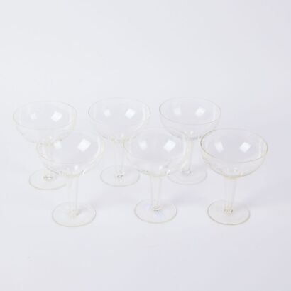 A Set Of Six Rose Etched Hollow Stem Champagne Coupes