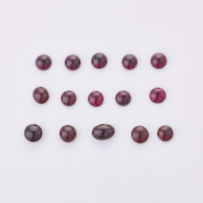Parcel of Fifteen, Oval Cabochon Cut Garnets totalling 32.00cts