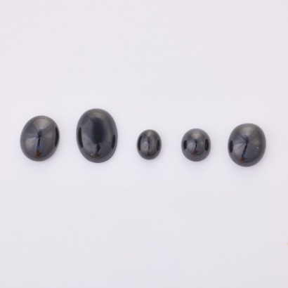 Parcel of Five, Loose Black Cabochon Cuts. (Three Onyx, One Rare Star Diopside, One Sapphire) totalling 74.25ct