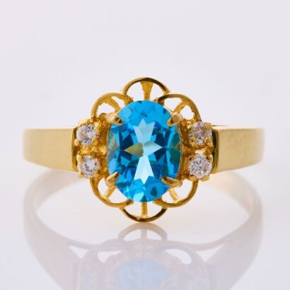 18ct Yellow Gold, Oval Blue Topaz / .05ct Diamond Ring