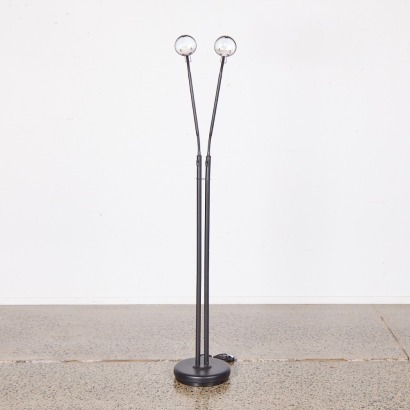 An Adjustable Twin Head Floor Lamp In Black