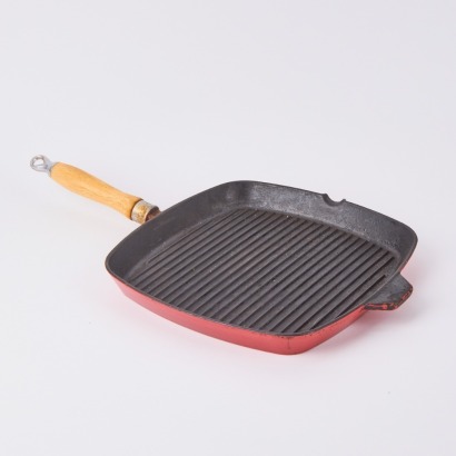 A Cast Iron Red Enamel Skillet