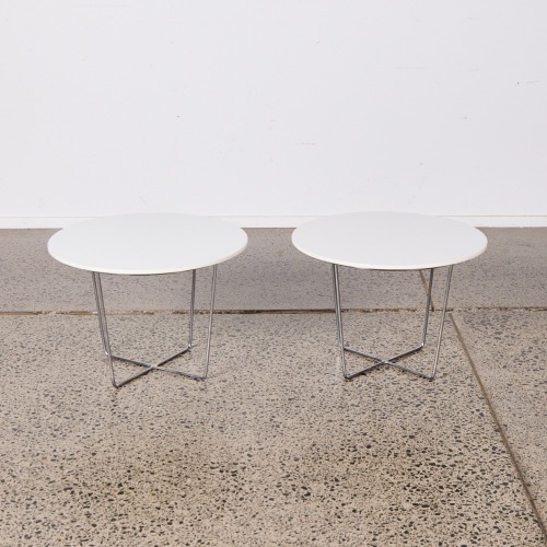 A Pair Of Contemporary Side Tables With A Steel Base