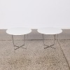 A Pair Of Contemporary Side Tables With A Steel Base